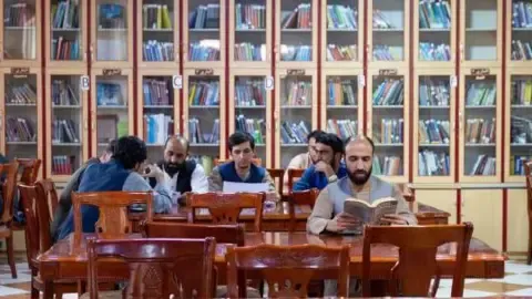 Afghanistan's rulers ban textbooks produced by women writers from the nation's universities